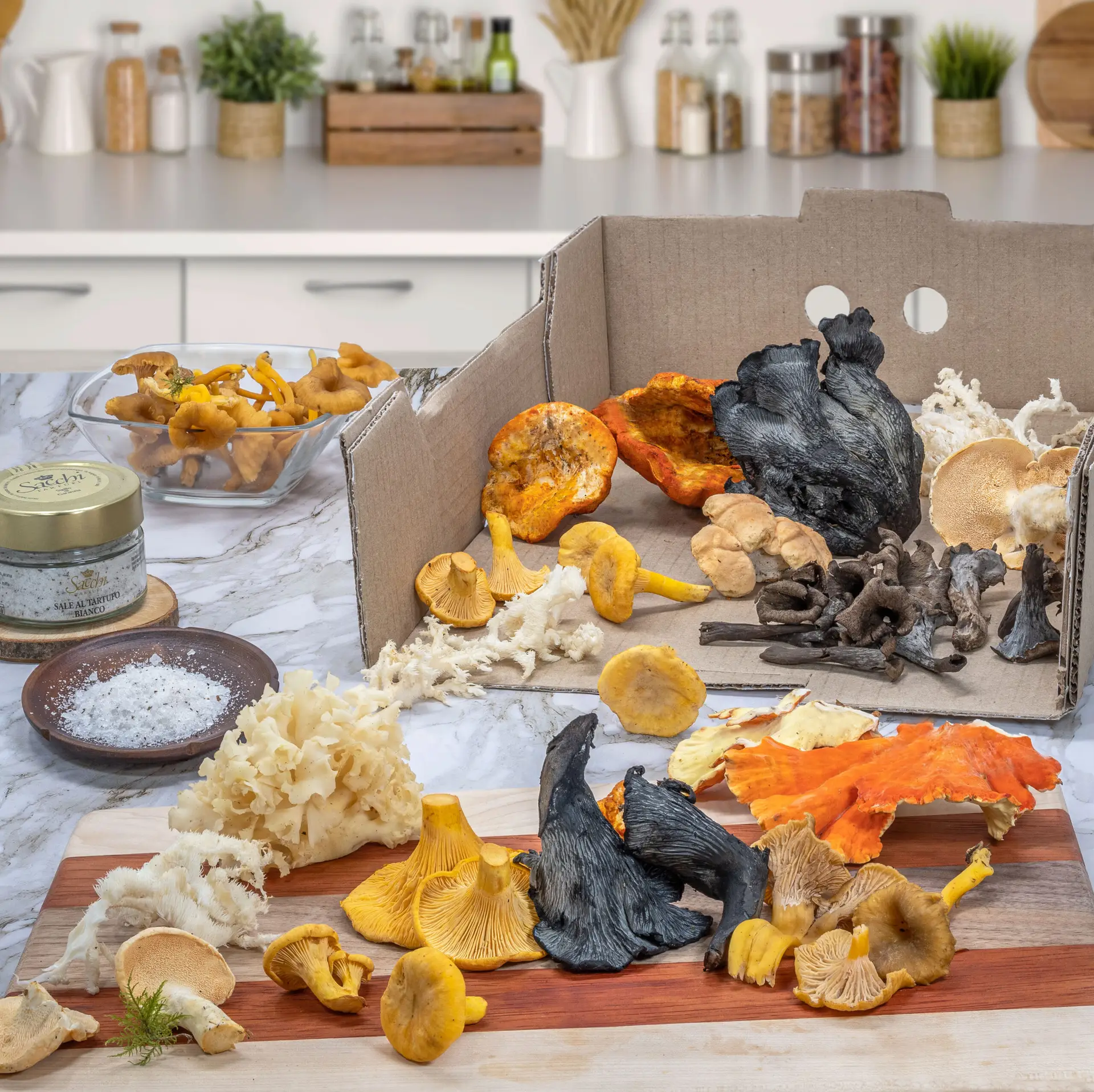 Wild foraged mushrooms displayed on a counter in a white kitchen purchased from Pebble Creek Produce.