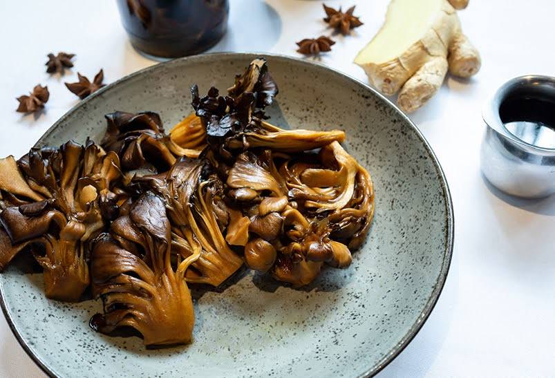 Shogun maitake mushrooms sauteed and ready to eat on a plate.